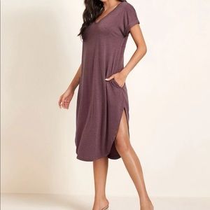 V neck rolled cuff Hidden pocket,  curved hem dress